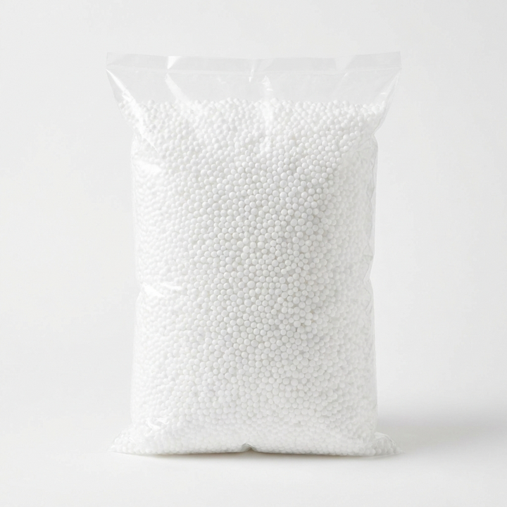 Sealed bag of white EPS bean bag filling beads on a white background