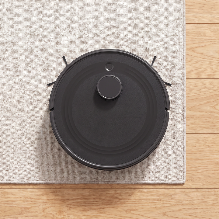Self-Emptying Robot Vacuum seen from above on a rug