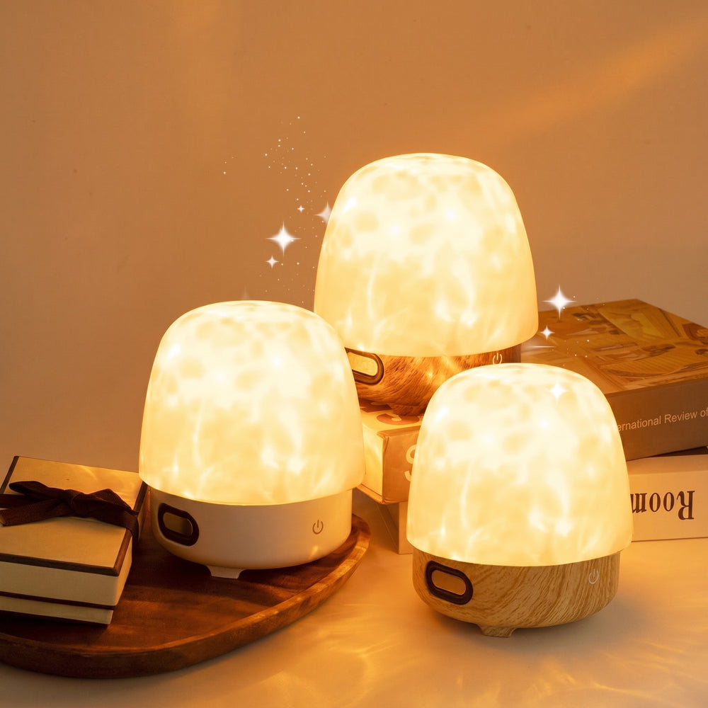Three crystal ripple lamps casting patterns on a wall